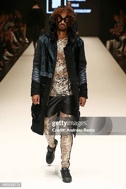 Model, wearing an outfit by the label La Folie, walks the runway at the AMD Akademie Mode & Design Best Graduate Show during Platform Fashion July...