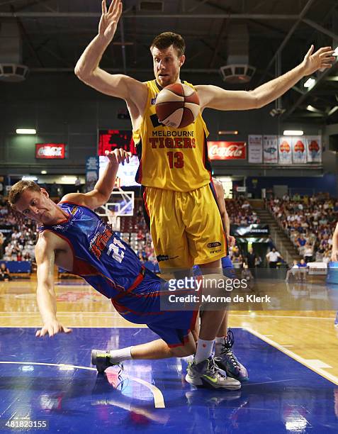 Scott Morrison of the Tigers fouls Daniel Johnson of the 36ers during game three of the NBL Semi Final series between the Adelaide 36ers and the...
