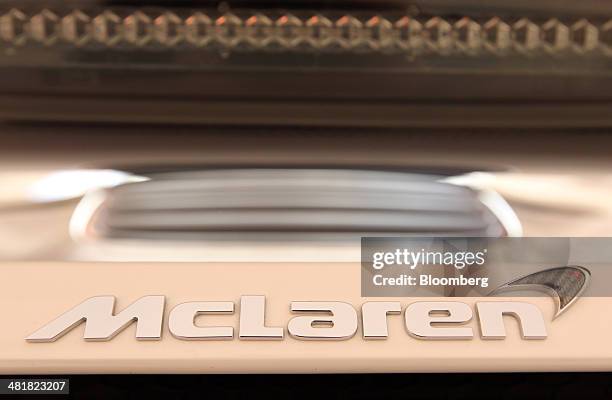 The McLaren Automotive Ltd. Logo is displayed on the company's McLaren 650S during a news conference in Tokyo, Japan, on Tuesday, April 1, 2014....