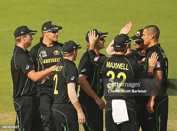 Nathan Coulter-Nile of Australia is congratulated by his teammates after dismissing Anamul Haque of Bangladesh during the ICC World Twenty20...