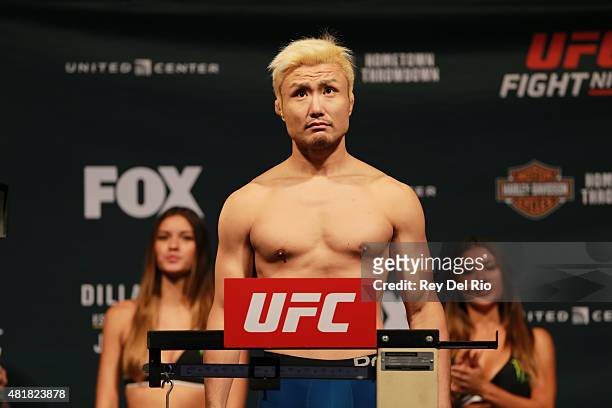 Takanori Gomi of Japan steps on the scale during the UFC weigh-in at the United Center on July 24, 2015 in Chicago, Illinois.