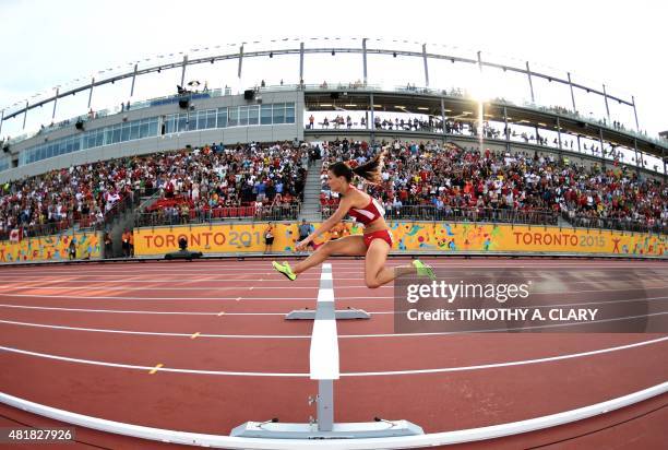 Ashley Higginson of the US competes en route to a gold medal victory in the Women's 3000m Steeplechase Final at the CIBC Athletics Stadium at the...