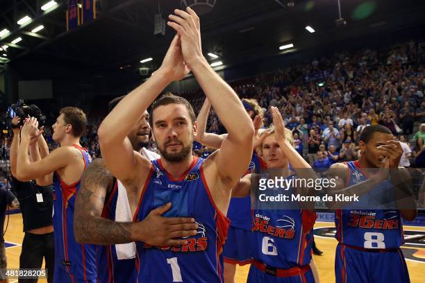 Adelaide players celebrate after winning game three of the NBL Semi Final series between the Adelaide 36ers and the Melbourne Tigers at Adelaide...