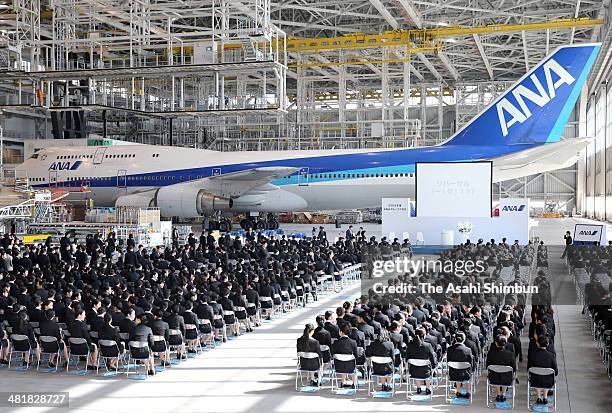 New employees of All Nippon Airways Co attend a welcoming ceremony at the ANA's hangar on April 1, 2014 in Tokyo, Japan. Japan's new fiscal and...