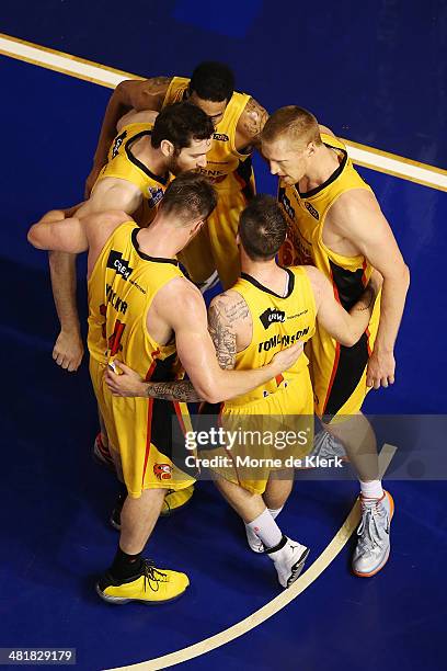Tigers players form a huddle during game three of the NBL Semi Final series between the Adelaide 36ers and the Melbourne Tigers at Adelaide Arena on...