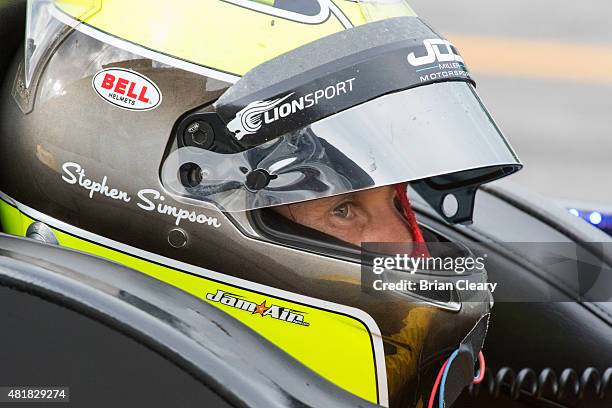 Stephen Simpson sits in his car during qualifying for the Northeast Grand Prix at Lime Rock Park on July 24, 2015 in Lakeville, Connecticut.