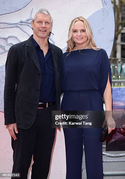 Neil Burger and Diana Kellogg attend the European premiere of "Divergent" at Odeon Leicester Square on March 30, 2014 in London, England.