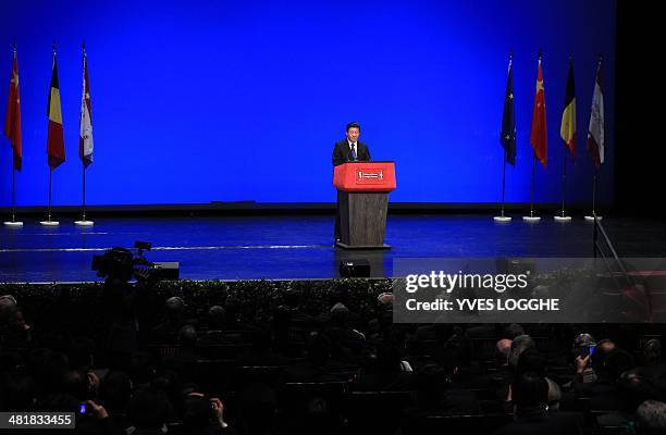 China's President Xi Jinping delivers a speech during a visit to the historical city of Bruges on April 1 on the last leg of a maiden tour of Europe....