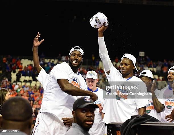 Patric Young and Will Yeguete of the Florida Gators celebrate after the SEC Men's Basketball Tournament against Kentucky Wildcats at the Georgia Dome...