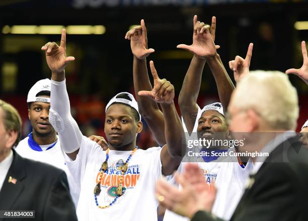 Will Yeguete of the Florida Gators celebrates after the SEC Men's Basketball Tournament against Kentucky Wildcats at the Georgia Dome on March 16,...