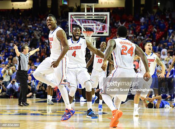 Patric Young, Will Yeguete, Casey Prather, Dorian Finney-Smith, and Scottie Wilbekin of the Florida Gators celebrate as the horn blows to win the SEC...