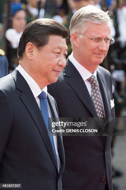 Chinese President Jinping Xi and King Philippe of Belgium take part in a ceremony after a visit to the historical city of Brugge, on April 1, 2014....