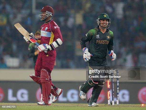 Marlon Samuels of the West Indies leaves the field after being dismissed as Kamran Akmal of Pakistan looks on during the ICC World Twenty20...