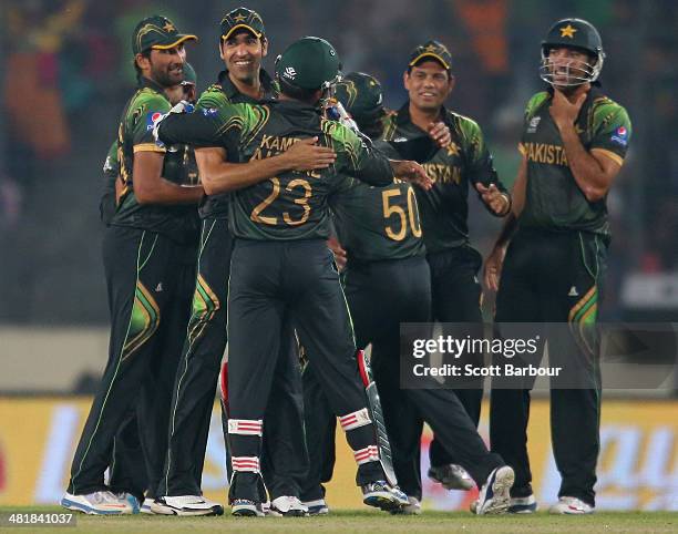 Pakistan celebrates the dismissal of Chris Gayle of the West Indies during the ICC World Twenty20 Bangladesh 2014 match between West Indies and...