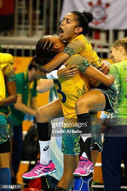 Alexandra Nascimento and Francie Da Rocha of Brazil celebrate winning the Gold medal against Argentina during the Women's Handball Final at the Pan...