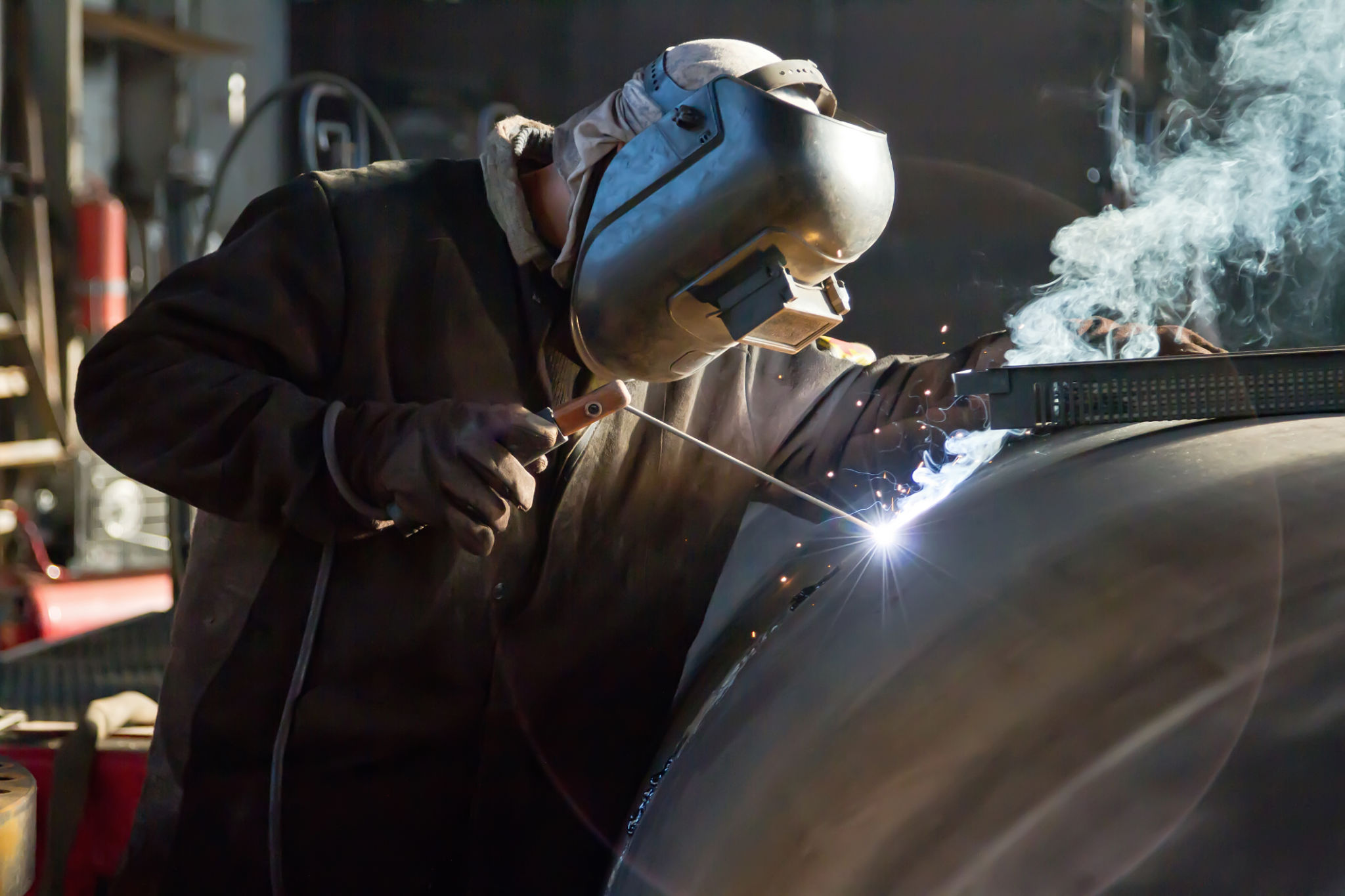 Welder busy parts of the pipeline Welder busy parts of the pipeline