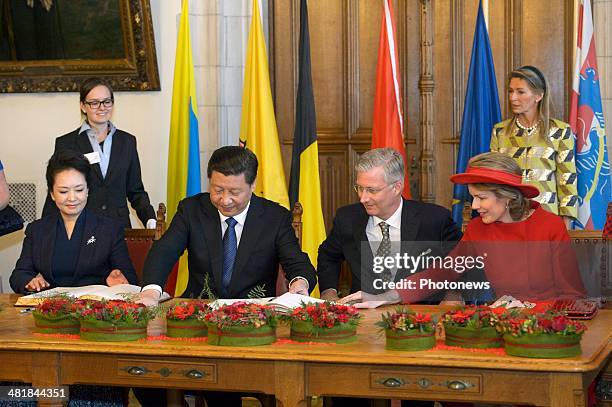 First Lady Xi-Peng Liyuan, Chinese President Xi Jinping, King Philippe and Queen Mathilde during a reception on April 1, 2014 in Bruges, Belgium.