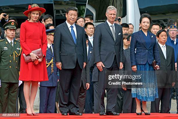 Chinese President Xi Jinping and First Lady Xi-Peng Liyuan observe a departure ceremony with King Philippe and Queen Mathilde, following an official...