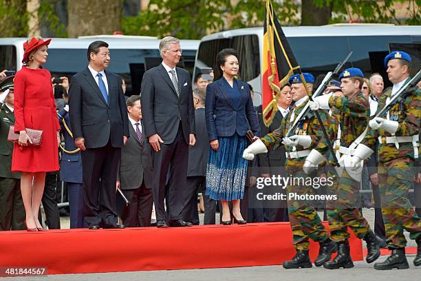 Chinese President Xi Jinping and First Lady Xi-Peng Liyuan observe a departure ceremony with King Philippe and Queen Mathilde, following an official...