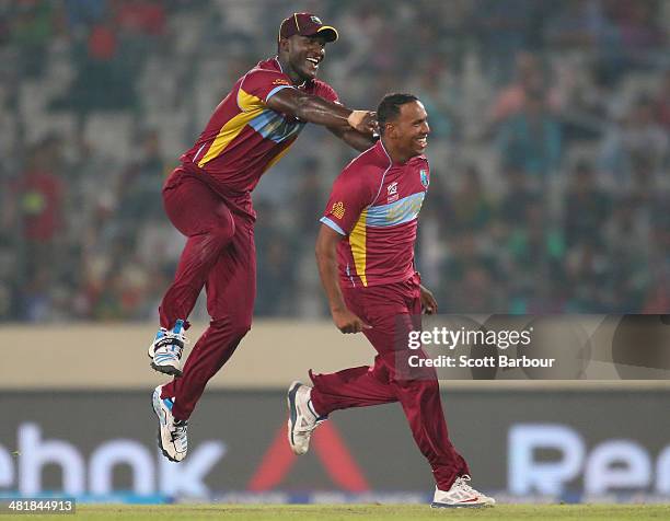 Samuel Badree of the West Indies is congratulated by Darren Sammy after dismissing Shoaib Malik of Pakistan during the ICC World Twenty20 Bangladesh...