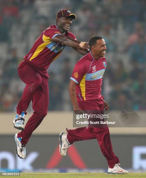 Samuel Badree of the West Indies is congratulated by Darren Sammy after dismissing Shoaib Malik of Pakistan during the ICC World Twenty20 Bangladesh...