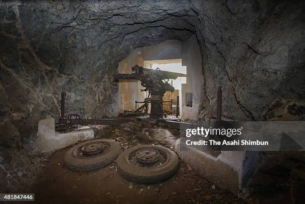 An anti-aircraft artillery piece of the former Japanese forces remains at Yoakeyama on Chichijima Island on May 28, 2015 in Ogasawara, Tokyo, Japan....