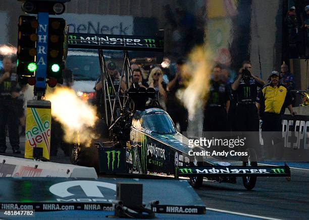 Top Fuel driver Brittany Force lights it up coming off the line and sets a new track record with a top speed of 323.74 mph on her first qualifying...