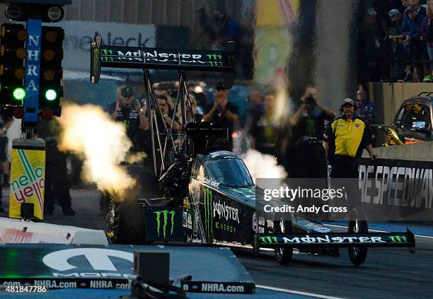 Top Fuel driver Brittany Force lights it up coming off the line and sets a new track record with a top speed of 323.74 mph on her first qualifying...