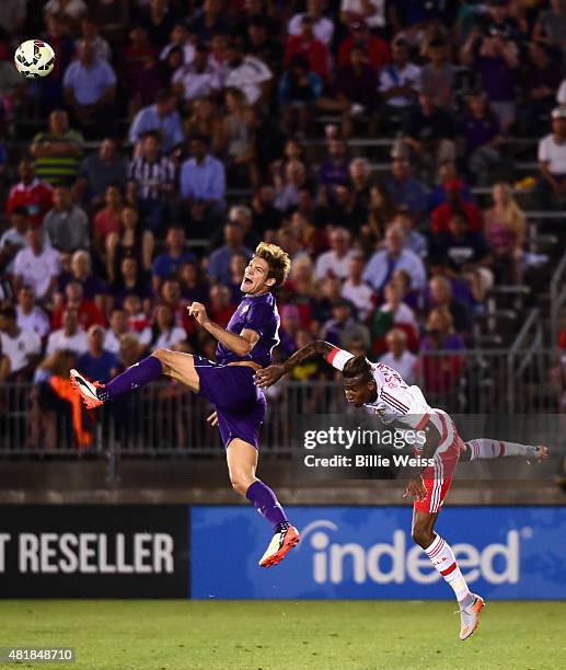 Marcos Alonso of ACF Fiorentina jumps for a ball as Anderson Talisca defends during the first half of an International Champions Cup 2015 match at...