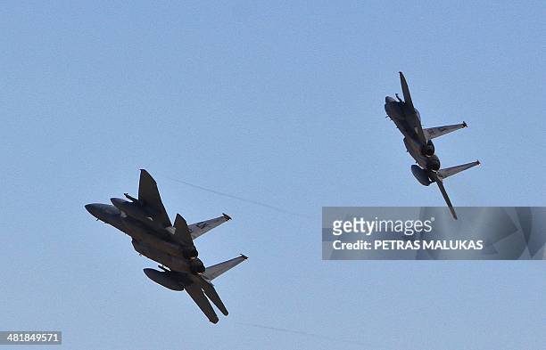 Eagle jet fighters fly over air force base during the Lithuanian - NATO air force exercise at the air force base near Siauliai Zuokniai, Lithunaia,...