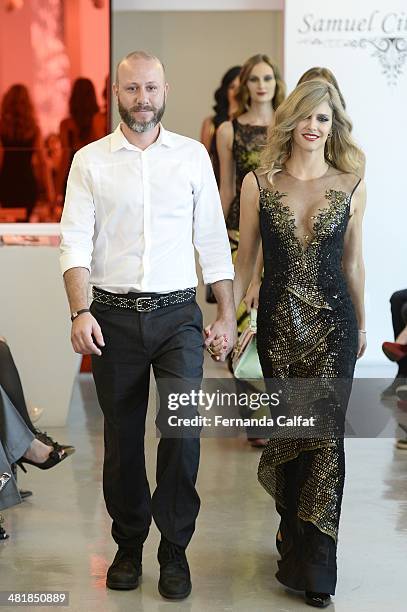 Fernanda Lima and Samuel Cirnansck attend the Samuel Cirnansck pocket show during Sao Paulo Fashion Week Summer 2014/2015 at the Citroen flagship...