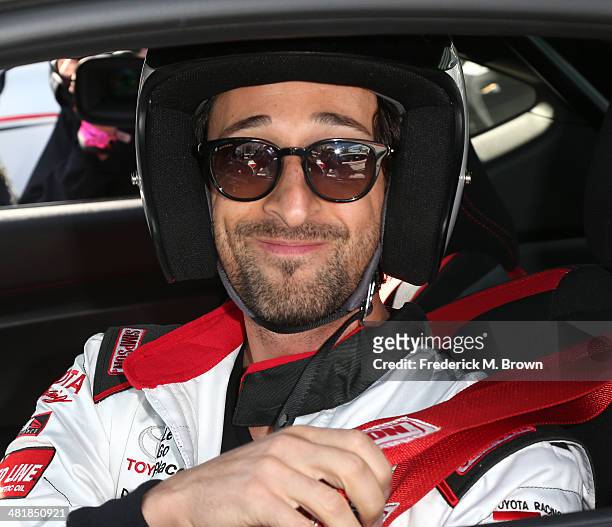 Actor Adrien Brody sits in his race car during the 37th Annual Toyota Pro/Celebrity Race Practice Day on April 1, 2014 in Long Beach, California.
