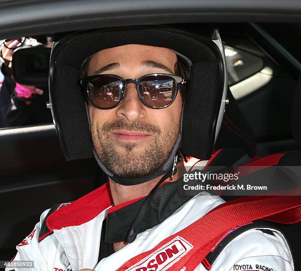 Actor Adrien Brody sits in his race car during the 37th Annual Toyota Pro/Celebrity Race Practice Day on April 1, 2014 in Long Beach, California.