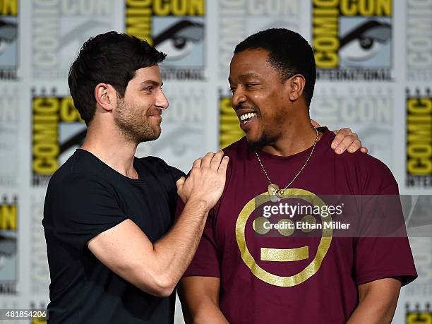 Actors David Giuntoli and Russell Hornsby attend the "Grimm" season five panel during Comic-Con International 2015 at the San Diego Convention Center...