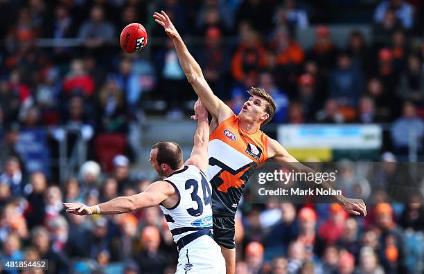 Rory Lobb of the Giants and Josh Walker of the Cats contest possession during the round 17 AFL match between the Greater Western Sydney Giants and...