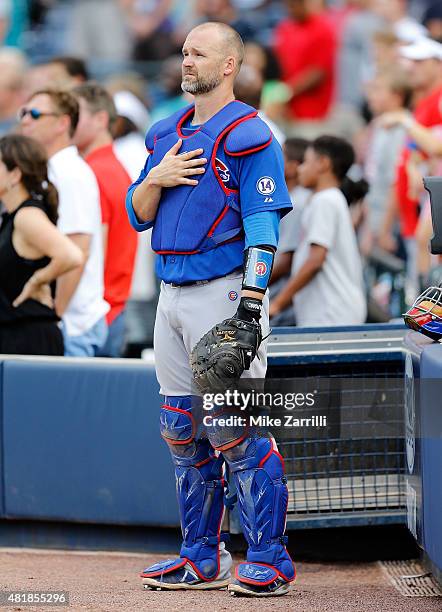 Catcher David Ross of the Chicago Cubs pauses during the singing of "God Bless America" during the game against the Atlanta Braves at Turner Field on...