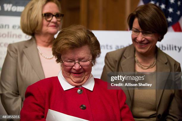 Sen. Barbara Mikulski , C, and U.S. Sen. Amy Klobuchar , R, share a moment during a press conference to urge Congress to pass the Paycheck Fairness...