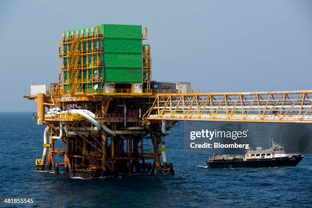 Support vessel sails away from the Petroleos Mexicanos Pol-A Platform complex, located on the continental shelf in the Gulf of Mexico, 70 kilometers...