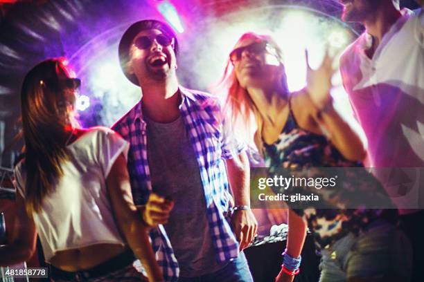 people dancing at a party. - disco dancing stock pictures, royalty-free photos & images