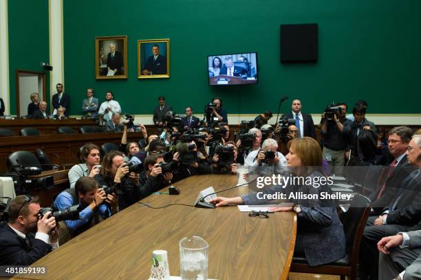 General Motors CEO Mary Barra prepares to testify before the full House Energy and Commerce hearing room in a hearing entitled "The GM Ignition...