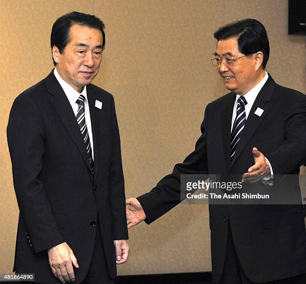 Japanese Prime Minister Naoto Kan and Chinese President Hu Jintao are seen prior to their bilateral meeting on the sidelines of the G20 Summit on...