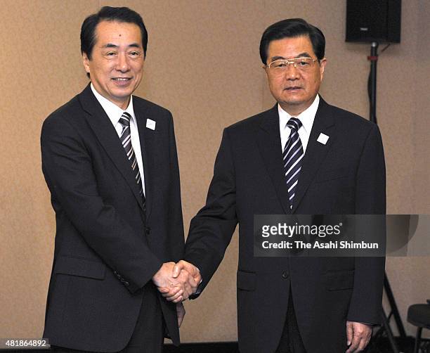 Japanese Prime Minister Naoto Kan and Chinese President Hu Jintao are seen prior to their bilateral meeting on the sidelines of the G20 Summit on...
