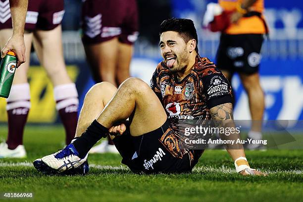 Shaun Johnson of the Warriors reacts after a knock to his leg during the round 20 NRL match between the New Zealand Warriors and the Manly Sea Eagles...