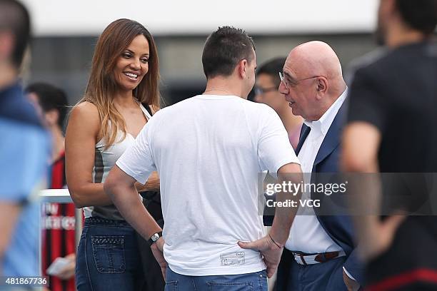 Adriano Galliani and Helga Costa speak with Cosmin Contra, former coach of Guangzhou R&F, during a training session at Shenzhen Stadium ahead of the...