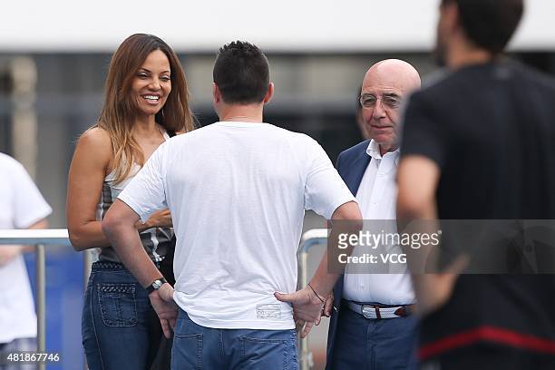 Adriano Galliani and Helga Costa speak with Cosmin Contra, former coach of Guangzhou R&F, during a training session at Shenzhen Stadium ahead of the...