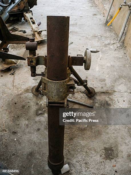 Mortar 60 mm inside the shop of Ibrahim Hassan for fixing. Ibrahim Hassan was born on 1973 in Korea. He is a gunsmith and an armorer from 1993 until...