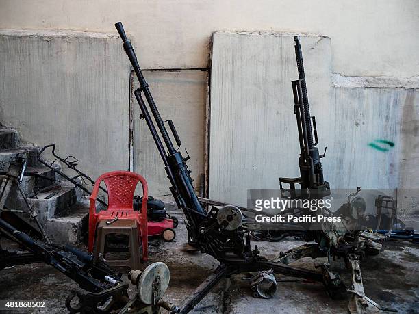 The strong weapons for front line under repair inside the shop of Ibrahim Hassan . Ibrahim Hassan was born on 1973 in Korea. He is a gunsmith and an...