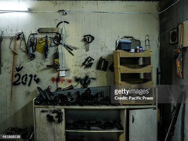 The inside view of of Ibrahim Hassan's shop. Ibrahim Hassan was born on 1973 in Korea. He is a gunsmith and an armorer from 1993 until 2013 by the...