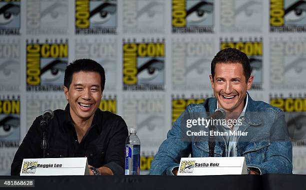 Actors Reggie Lee and Sasha Roiz attend the "Grimm" season five panel during Comic-Con International 2015 at the San Diego Convention Center on July...