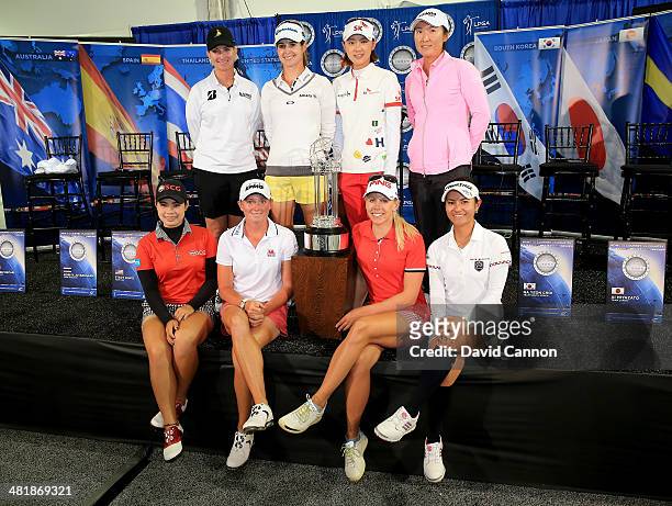 Players from each of the eight competing countries pose with the trophy Karrie Webb of Australia, Beatriz Recari of Spain, Na Yeon Choi of South...